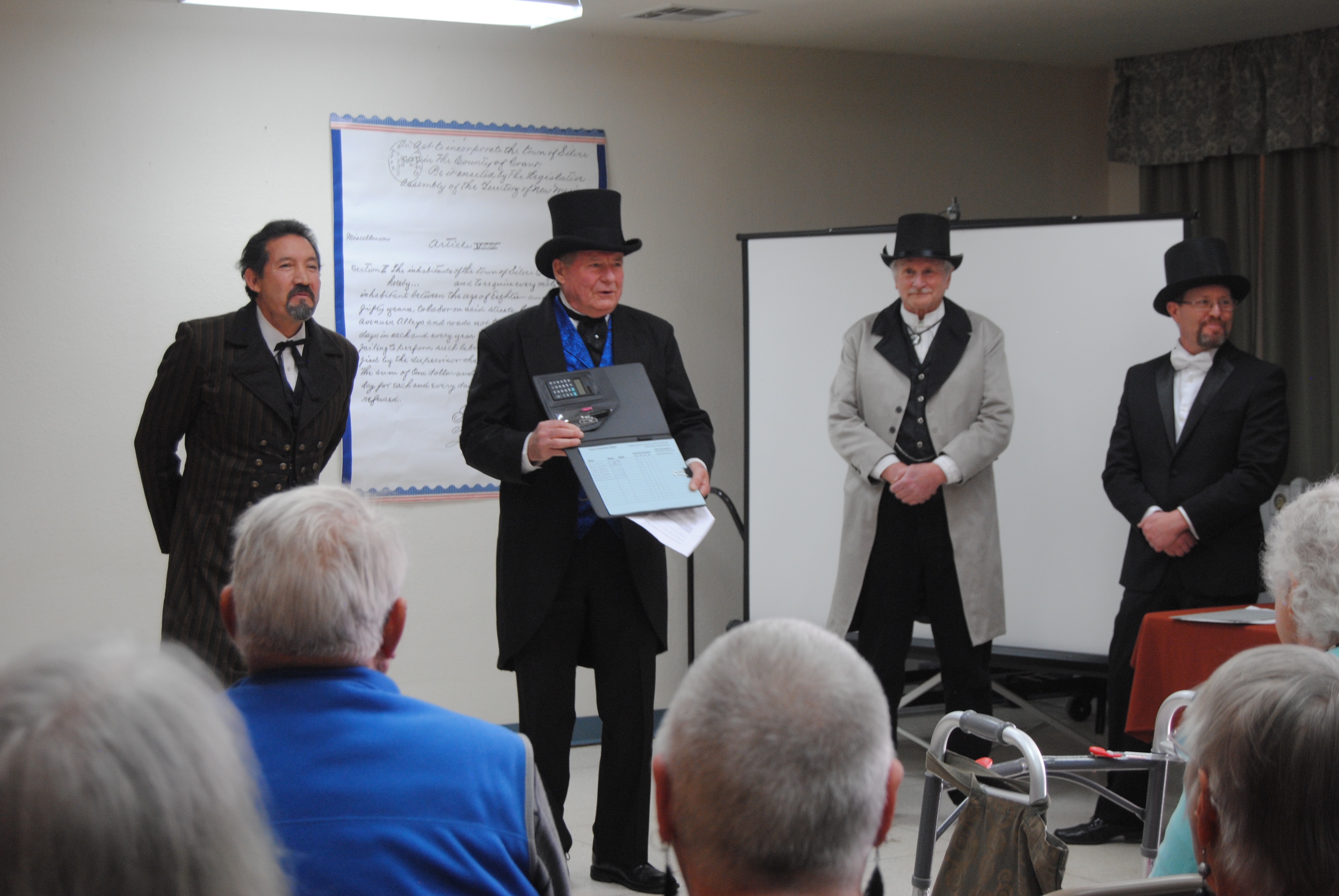 Officials re-enact Territorial Charter signing